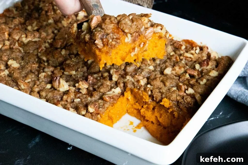 Slice of casserole coming out of the pan.