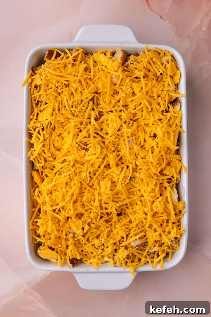 Savory Chive French Toast Casserole Recipe for Brunch 8 Savory French toast casserole with a generous layer of cheddar cheese on top.