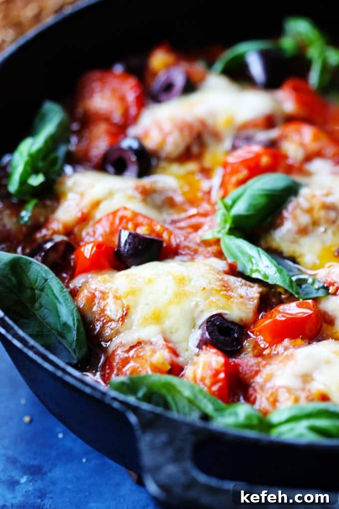 Veal Rollatini with Peppers, Cheese & Basil in Tomato-Olive Sauce 4 Veal Rollatini in Tomato Basil Sauce with Cheese in a skillet