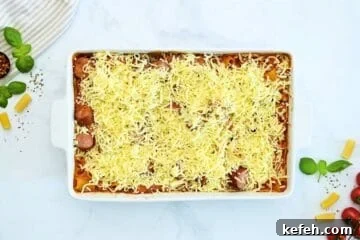 Cheesy Baked Rigatoni with Marinara and Mozzarella 6 Baked rigatoni after baking until tender topped with cheese in large casserole dish.