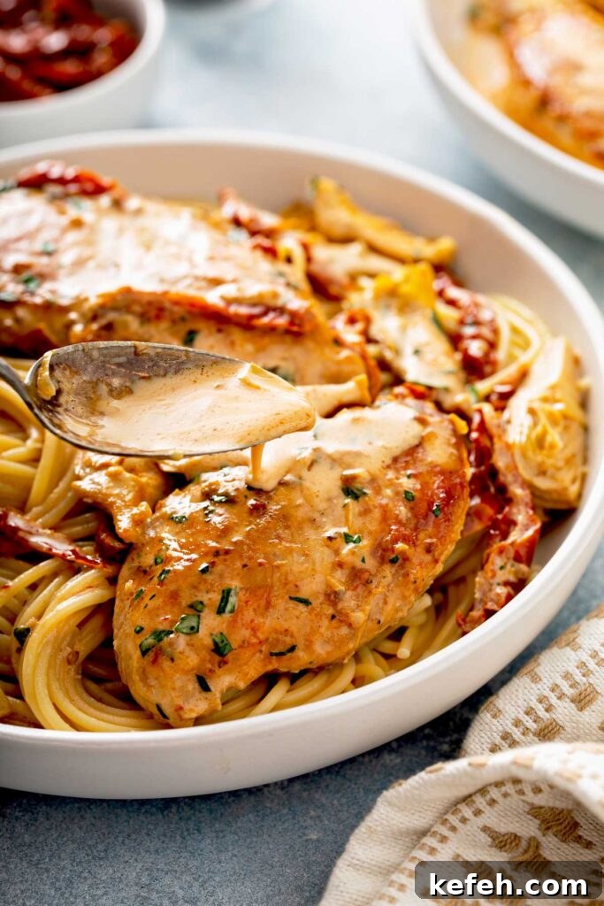 Creamy Sun-Dried Tomato Chicken Skillet Recipe 3 Creamy sun dried tomato sauce is poured over juicy golden brown chicken breast on a bed of pasta.