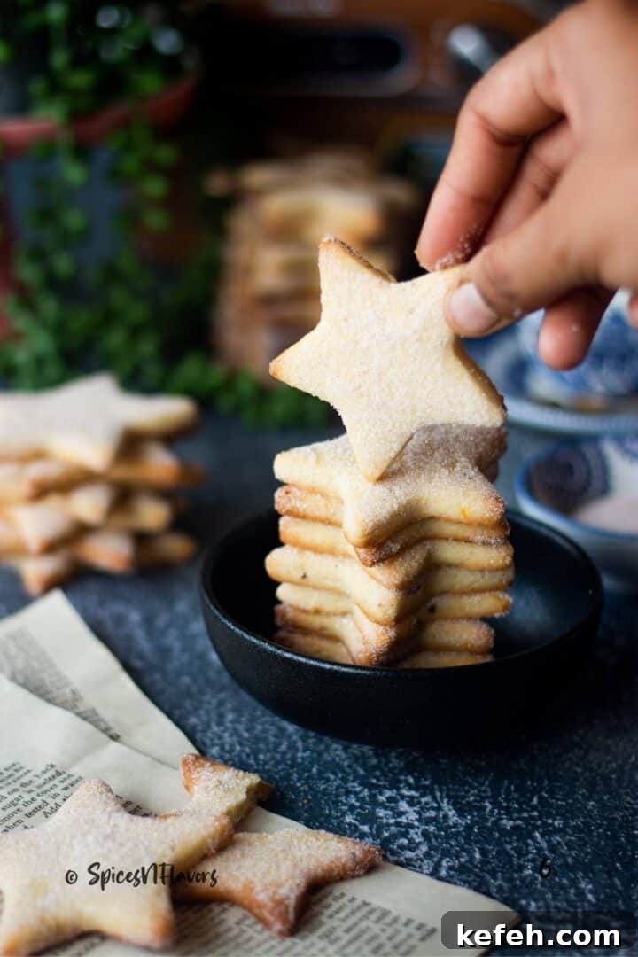 Biscochitos Recipe Without Lard — New Mexico’s Traditional Cookies 13 a star cookie lifted using fingers