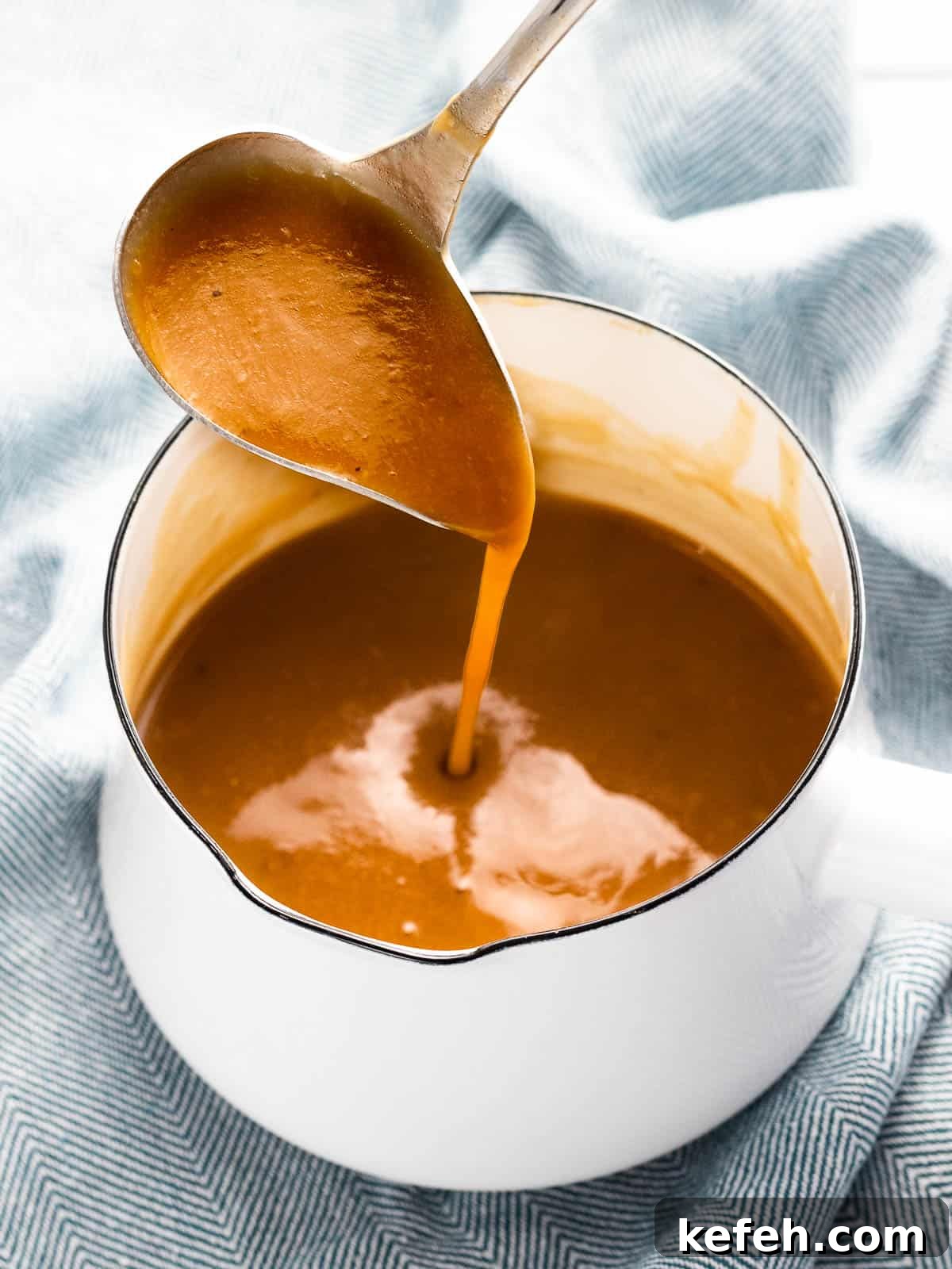 Homemade Brown Gravy Without Drippings: Simple Stove-Top Recipe 4 Brown gravy thickened with butter and flour roux in a saucepan.