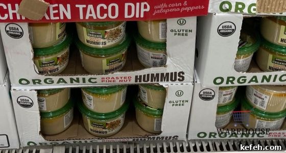 Top Costco Thanksgiving Appetizers for 2025 Holiday Entertaining 12 Kirkland Signature Hummus from Costco with pita and veggies — simple healthy Costco Thanksgiving appetizer.