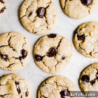 Chocolate chip cookies on a metal pan.