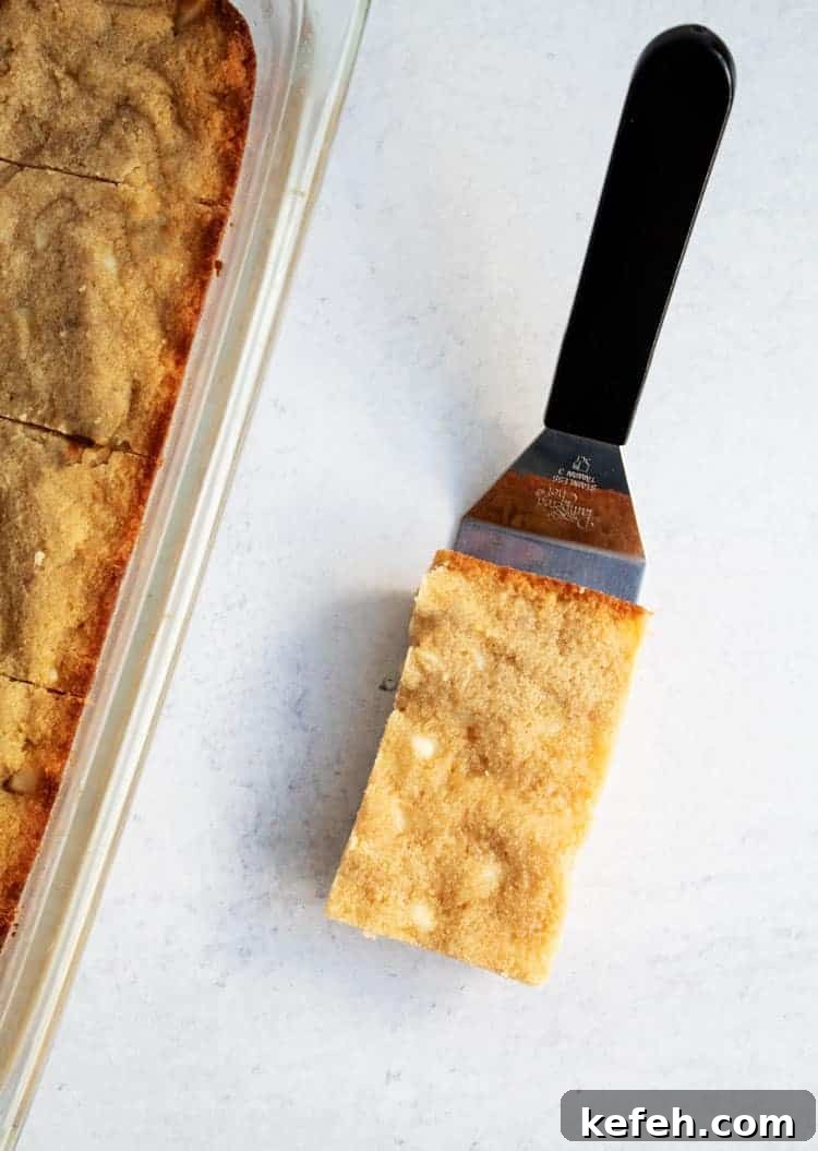 keto white chocolate macadamia nut cookies bar next to pan