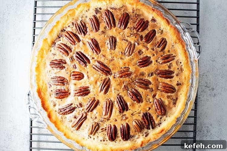 overhead view of a keto pecan pie on a cooling rack