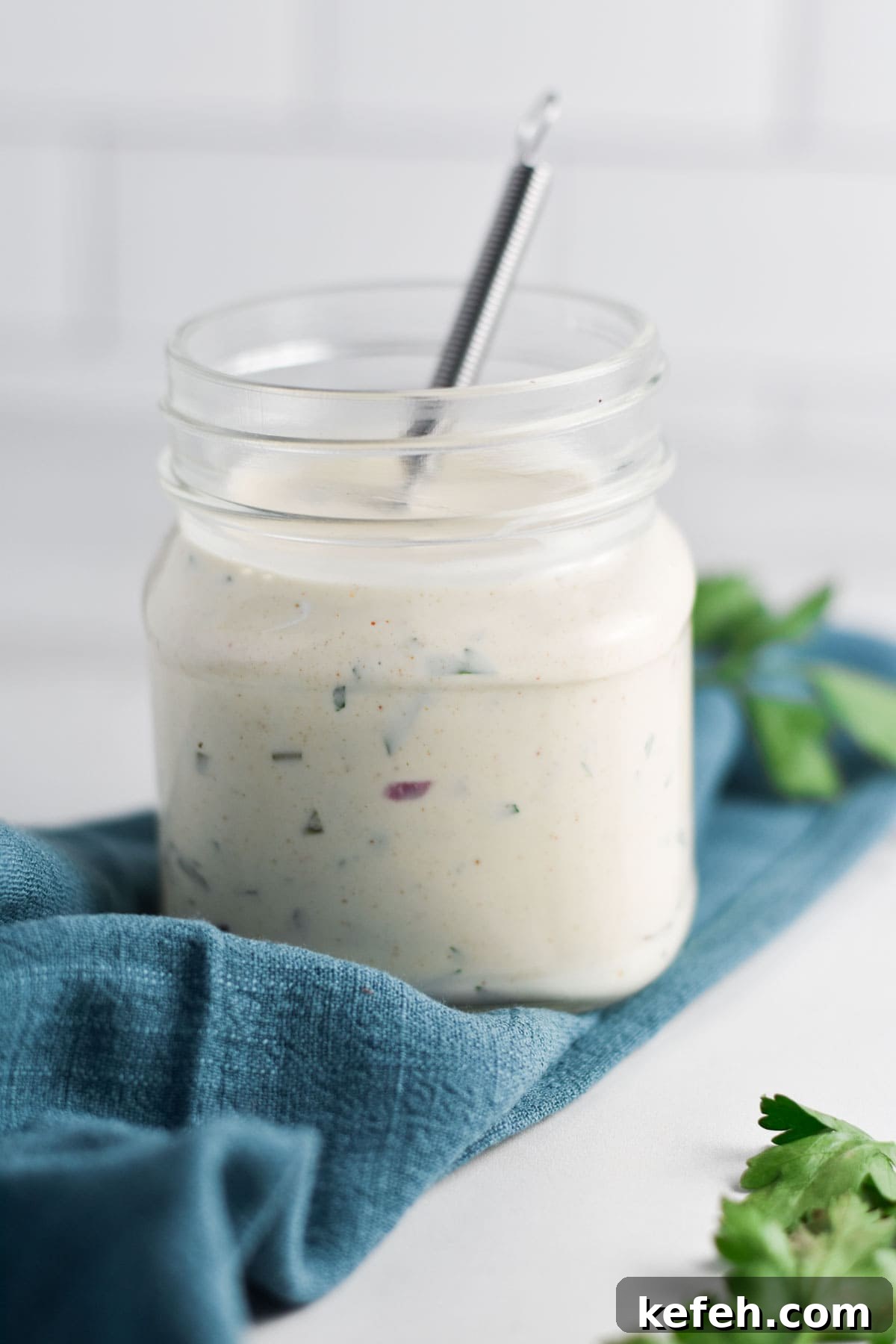 Creamy Homemade Gluten-Free Ranch Dressing Recipe 2 A mason jar with homemade ranch dip.