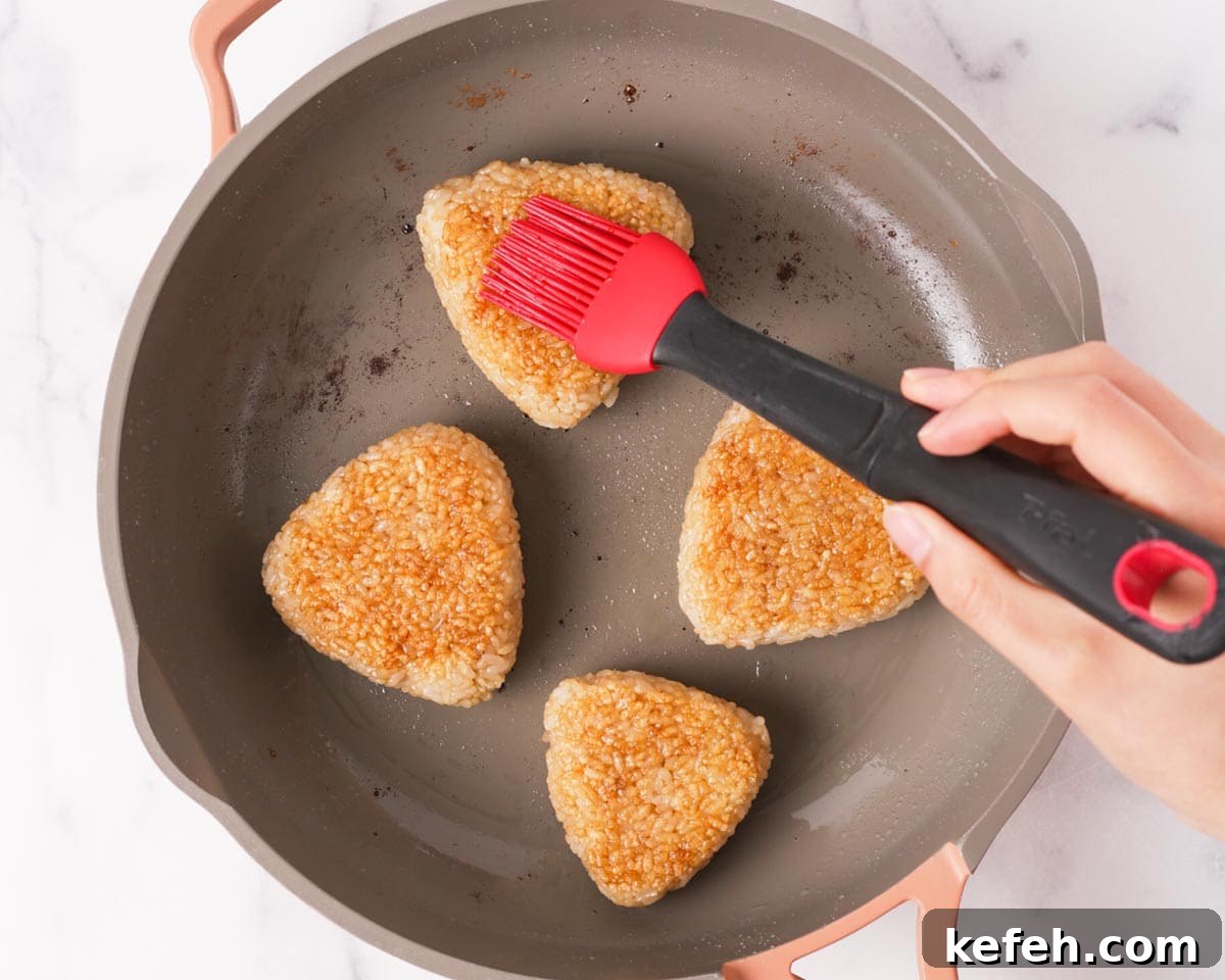 How to Make Spam Yaki Onigiri: Grilled Spam Rice Balls Recipe 9 Brushing sauce