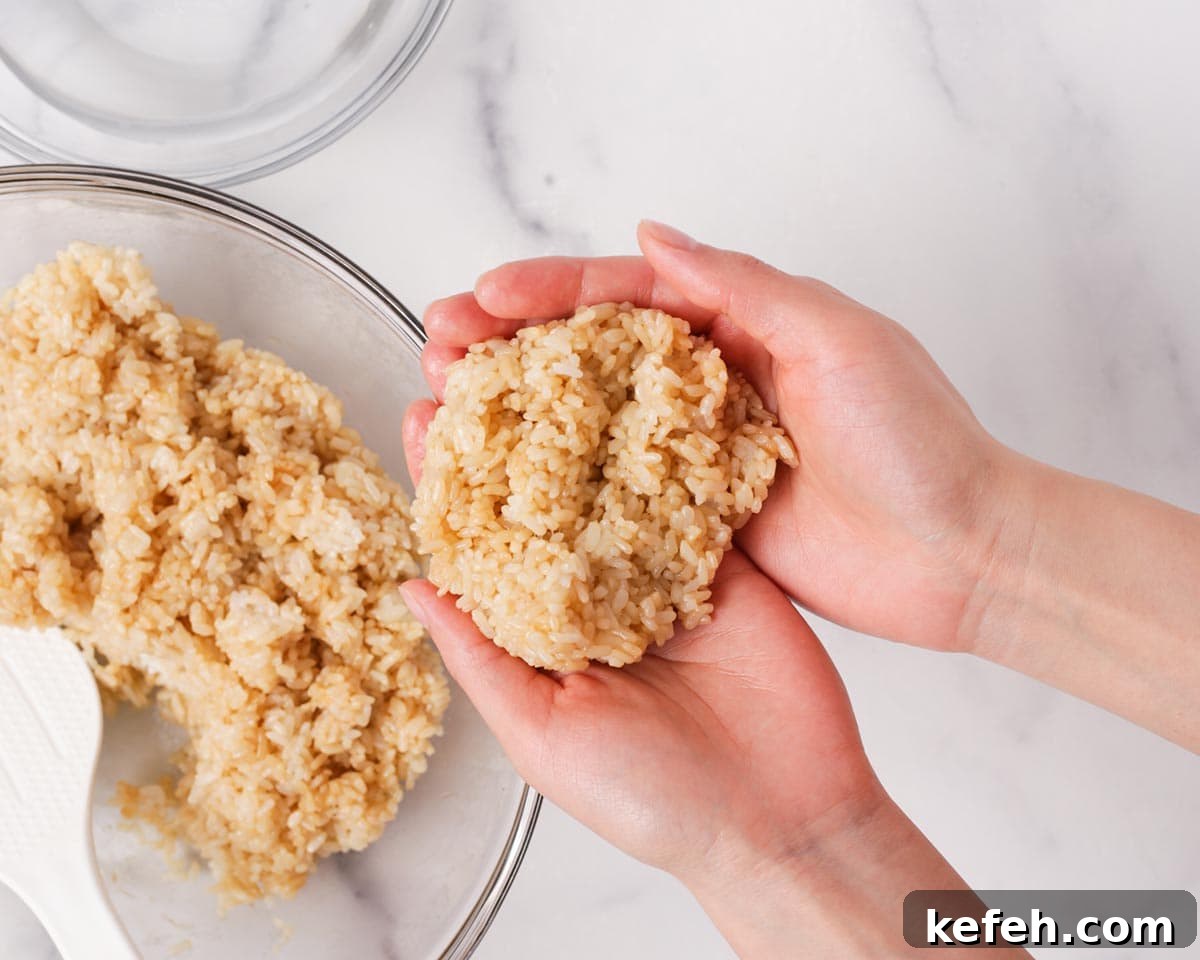 How to Make Spam Yaki Onigiri: Grilled Spam Rice Balls Recipe 13 Forming rice in hands