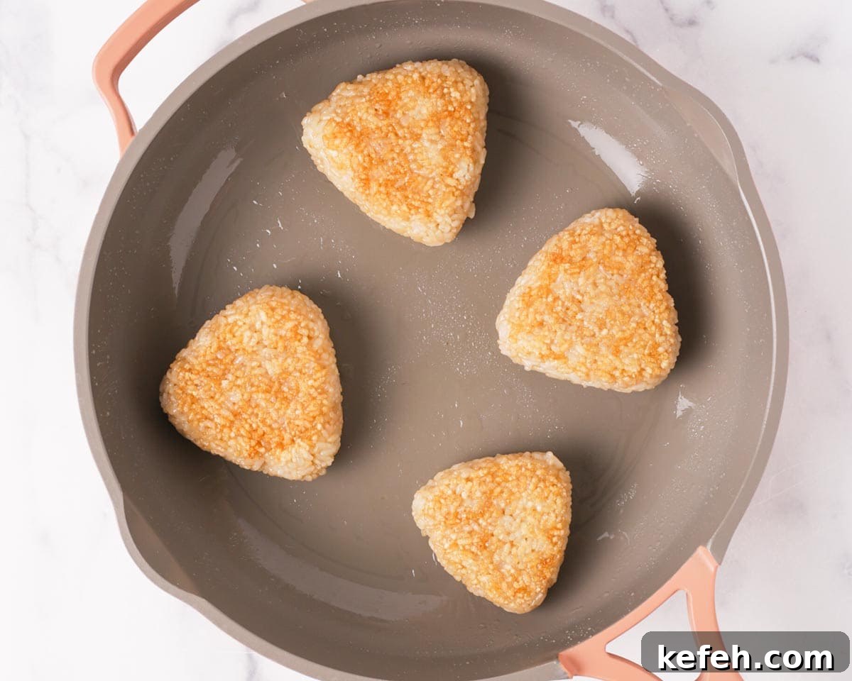 How to Make Spam Yaki Onigiri: Grilled Spam Rice Balls Recipe 8 Onigiri flipped in pan