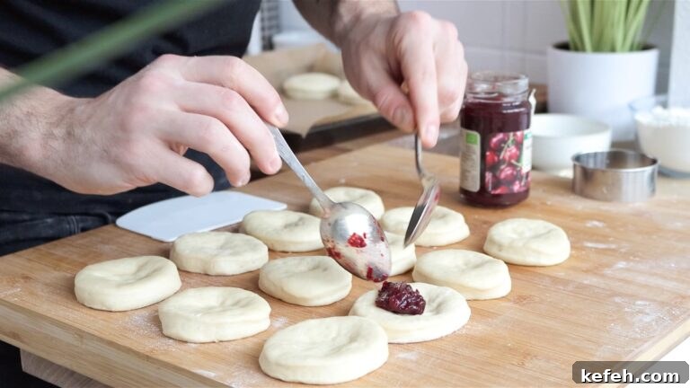 Vegan Bomboloni: Authentic Italian Filled Donuts Recipe 12 Putting jam inside the bomboloni