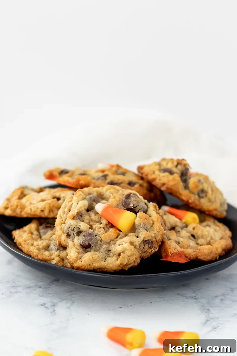 candy corn chocolate chip cookies on a black plate