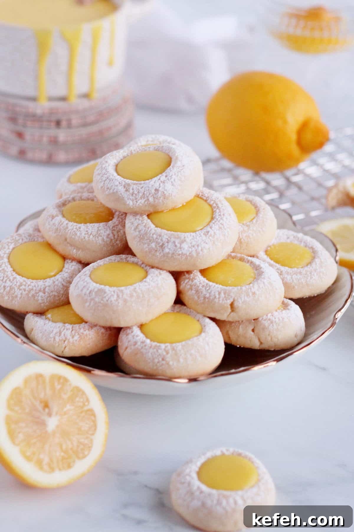 Tower made up of lemon thumbprint cookies filled with lemon curd.