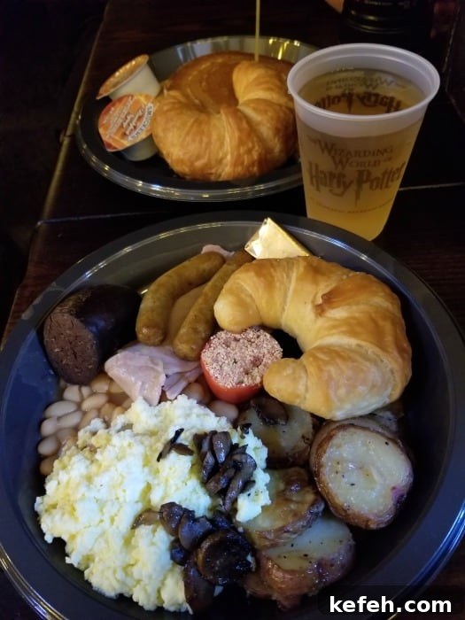 Top Tips for Visiting The Wizarding World of Harry Potter 9 plate nwith bread, sausage, beans, and potatoes next to a Butter beer
