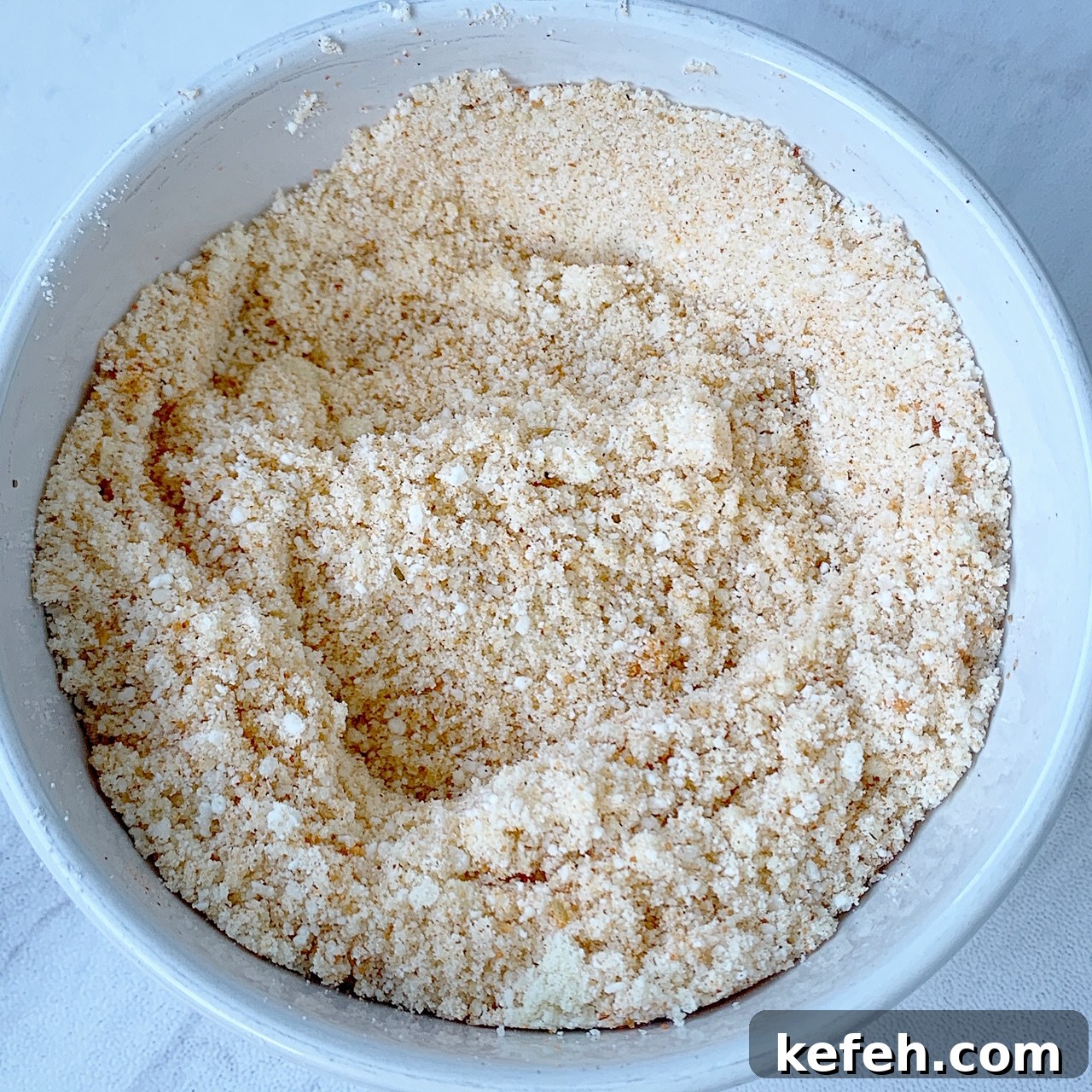 almond flour & Parmesan cheese with Tony Chachere's no salt seasoning in a bowl
