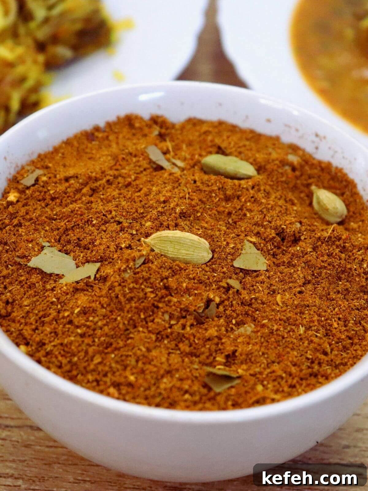 Authentic Homemade Biryani Masala Powder Recipe 2 close-up of biryani masala powder in a white color bowl.