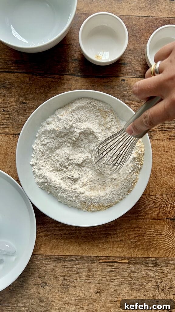 Greek Saganaki: Crispy Fried Cheese with Lemon 5 Mixing the flour and breadcrumbs