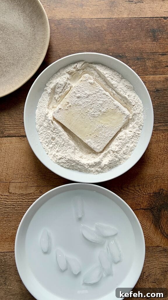 Greek Saganaki: Crispy Fried Cheese with Lemon 7 Dipping cheese in ice water