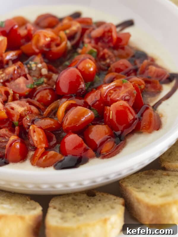 Fresh homemade bruschetta dip on creamy ricotta.