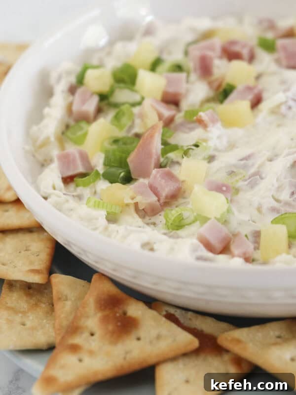 Hawaiian Ham Dip on a tray with crackers.