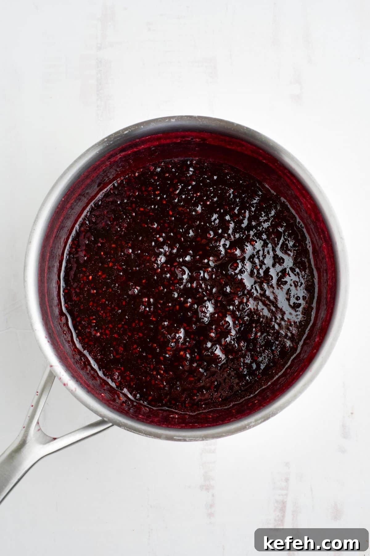 Spicy Blackberry Jalapeño Jam Recipe for Preserving and Gifts 7 Fully cooked blackberry jalapeno jam in a saucepan.