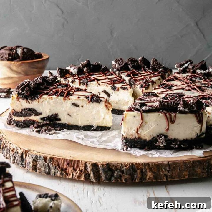 Gluten Free Oreo Cheesecake on a rustic wooden cake stand.