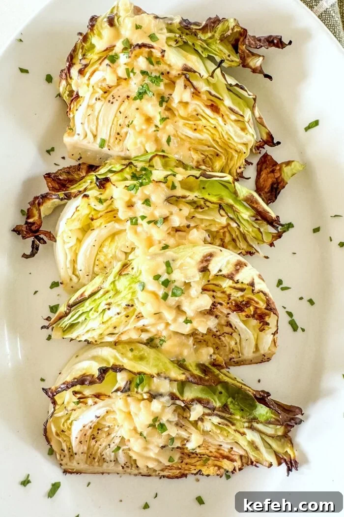 roasted cabbage wedges on white platter