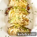 roasted cabbage wedges on white platter