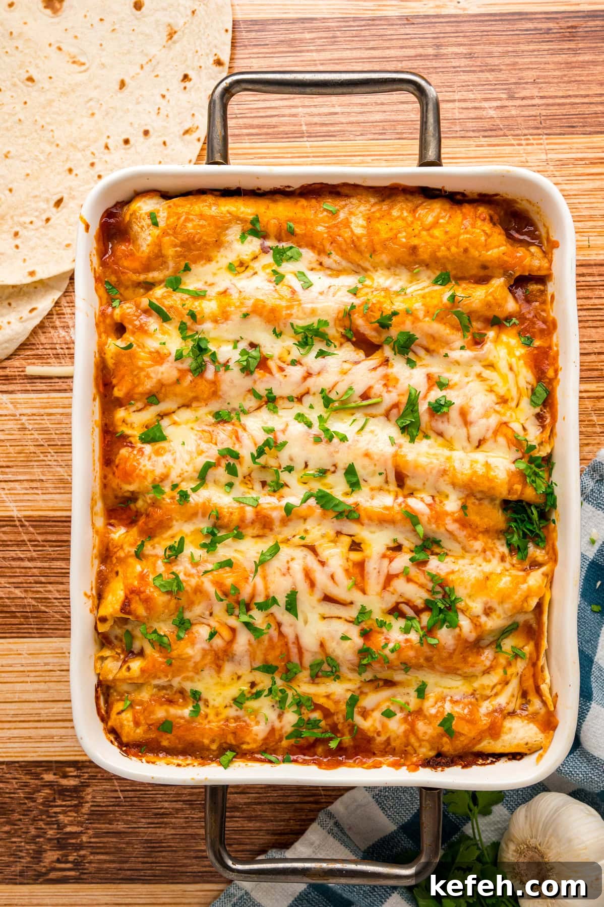 Overhead view of a casserole dish of chicken enchiladas