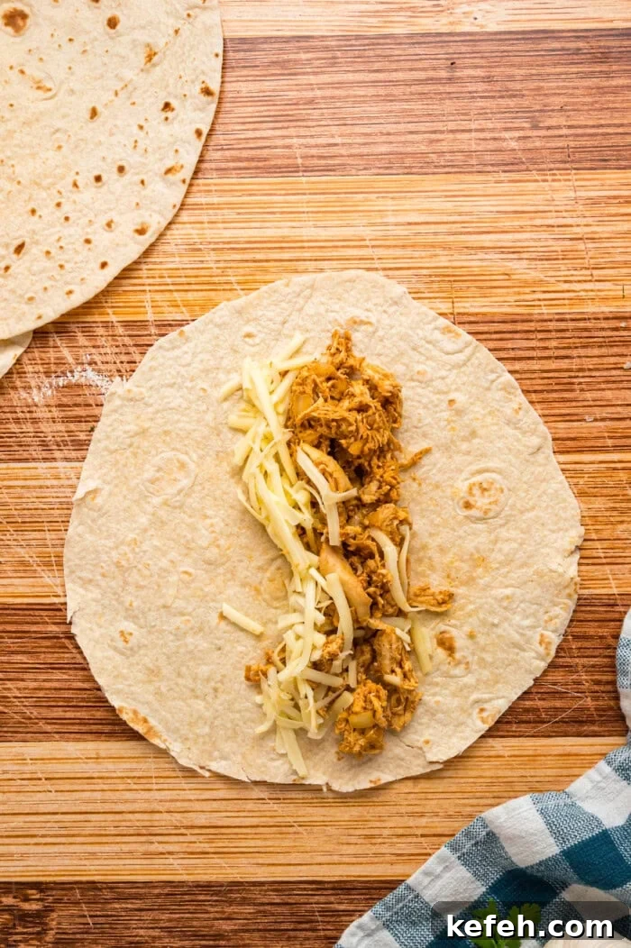 Shredded chicken and cheese in a tortilla