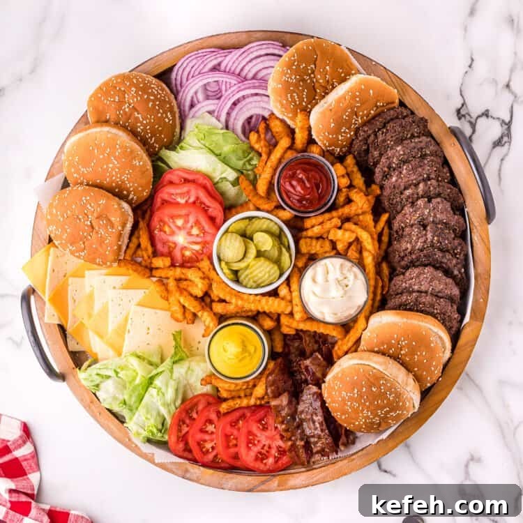 Overhead image of round wood platter with burgers and toppings