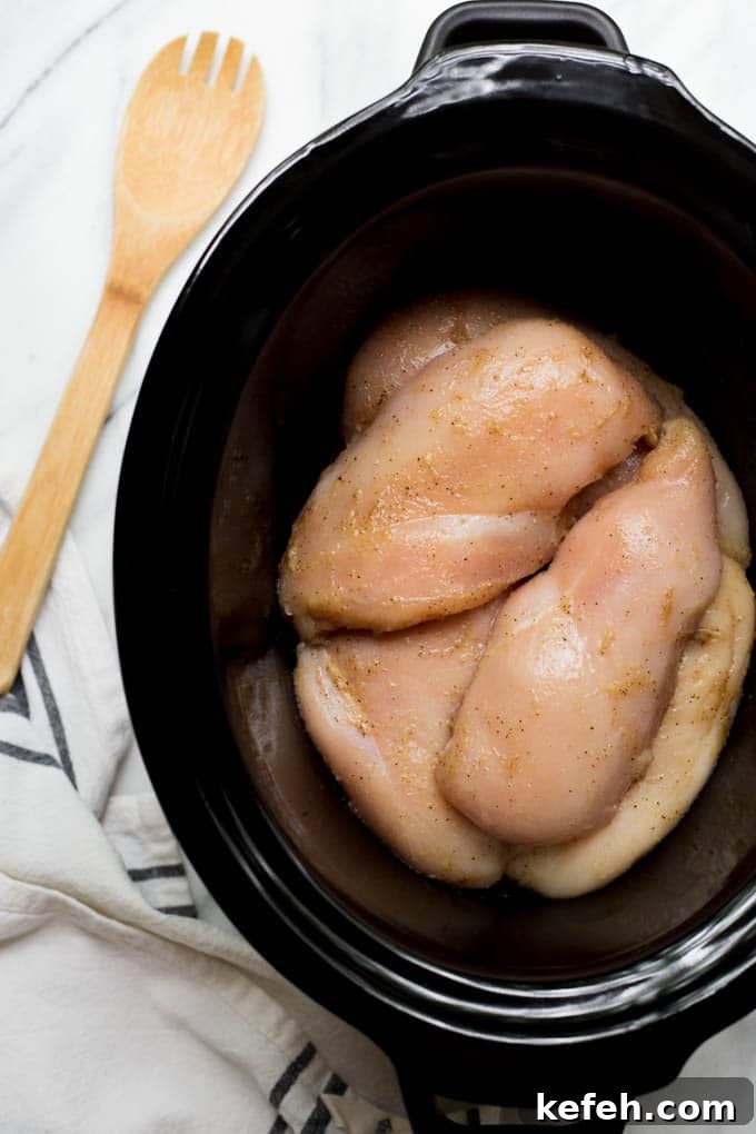 Raw chicken in slow cooker.