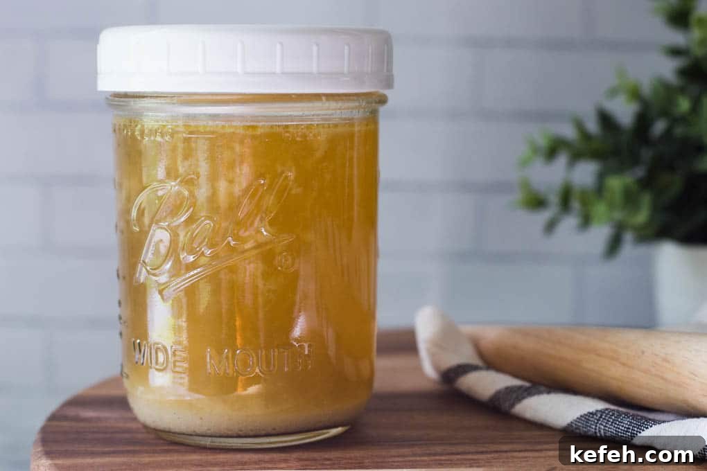 Chicken stock in a mason jar.