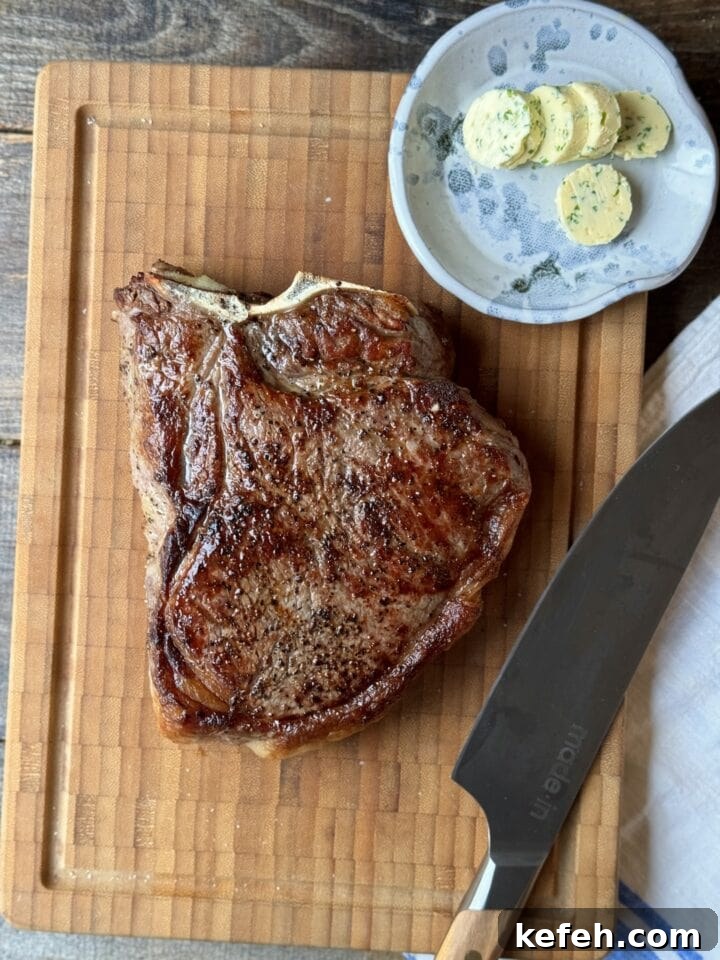 T-Bone Steak Recipe with Garlic Butter and Herbs 12 Juicy grilled steak with herb butter on wooden board, perfect for comforting home-cooked meals.