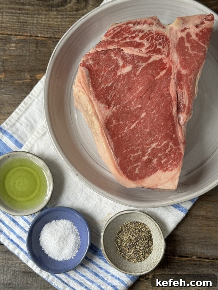 T-Bone Steak Recipe with Garlic Butter and Herbs 10 Juicy raw beef steak with seasoning and oil, ready for grilling or cooking. Perfect for hearty meals and flavorful recipes.