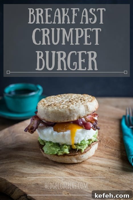 Breakfast Crumpet Burger on a wooden board with a knife and fork and a cup of coffee