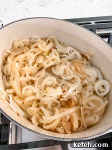 Classic French Onion Soup Recipe: Rich, Comforting Bowl of Flavor 6 The onions slightly yellowed and softened