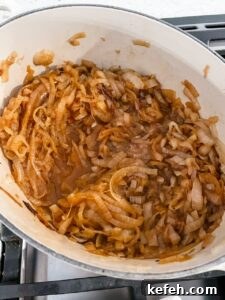 Classic French Onion Soup Recipe: Rich, Comforting Bowl of Flavor 8 The onions completely softened, browned, and releasing liquid