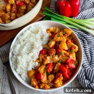 easy copycat panda express sweet fire chicken in a white serving bowl.