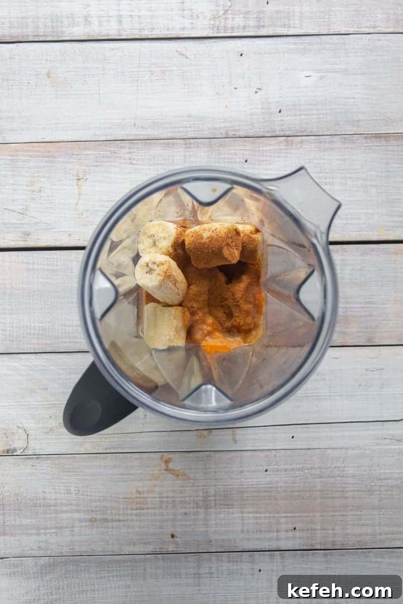 Pumpkin Spice Latte Smoothie Recipe for Fall Morning Energy 3 Pumpkin Spice Latte Smoothie ingredients in blender