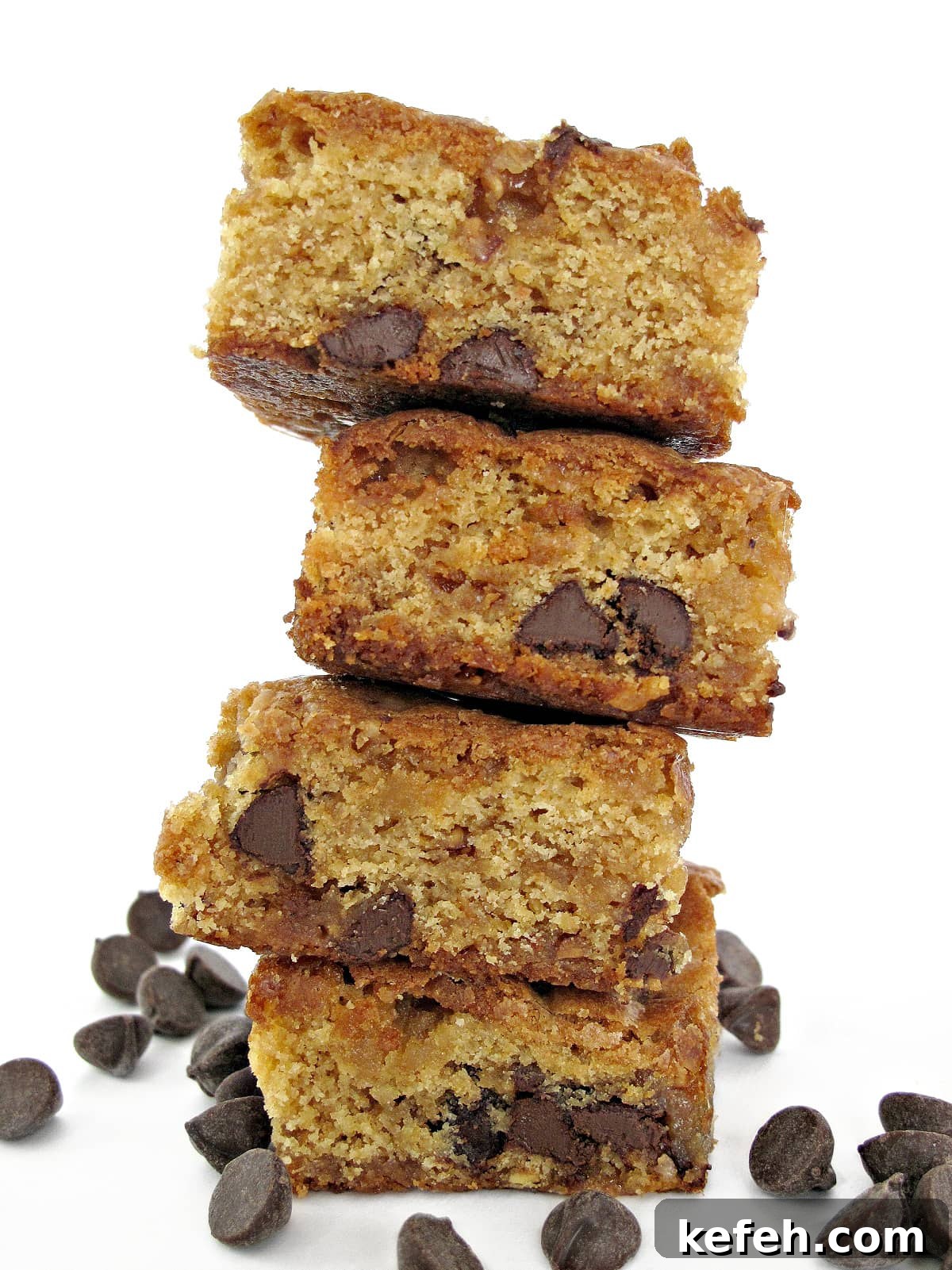 Stack of thick cookie bars with chocolate chips inside.