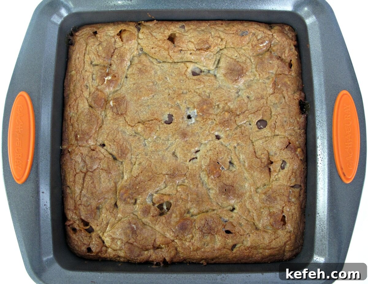 Chocolate Chip Cookie Bars in square baking pan.