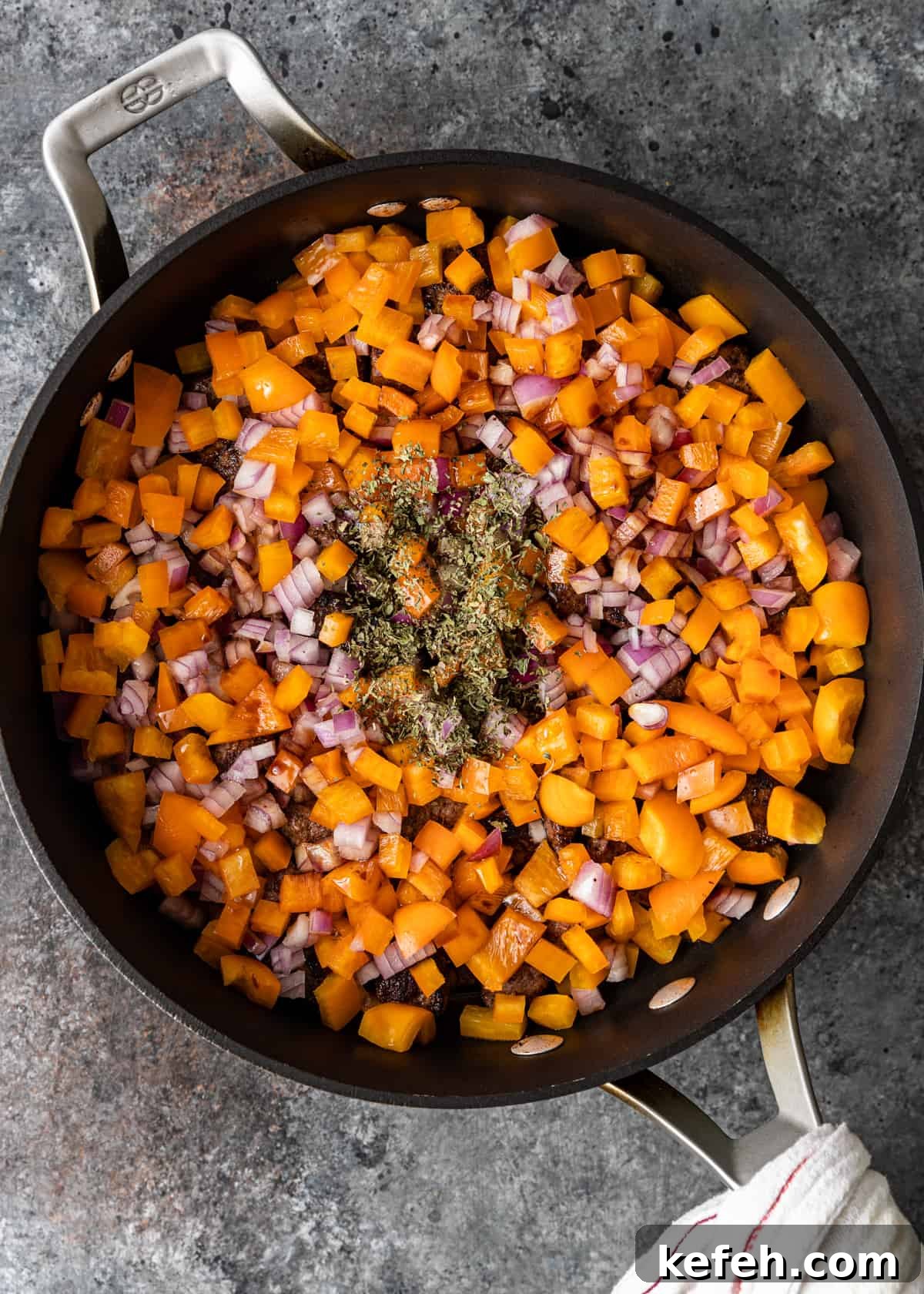 overhead process shot: titled image (and shown) add veg and seasonings