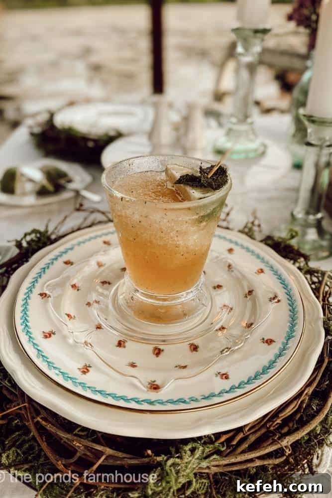 Fresh Summer Dinner Party Menu Ideas for Entertaining Guests 4 Glass of frozen peach mojito on top of a floral plate at a place setting on a table
