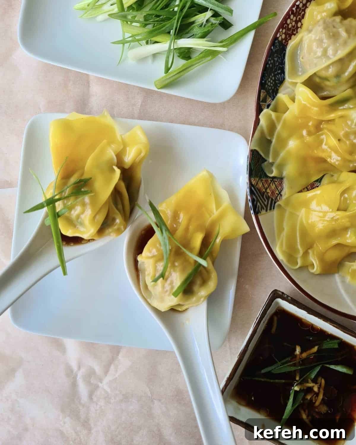 Crispy Pork Wontons Recipe with Ginger-Soy Dipping Sauce 7 2 pork wontons on Chinese soup spoons with dipping sauce