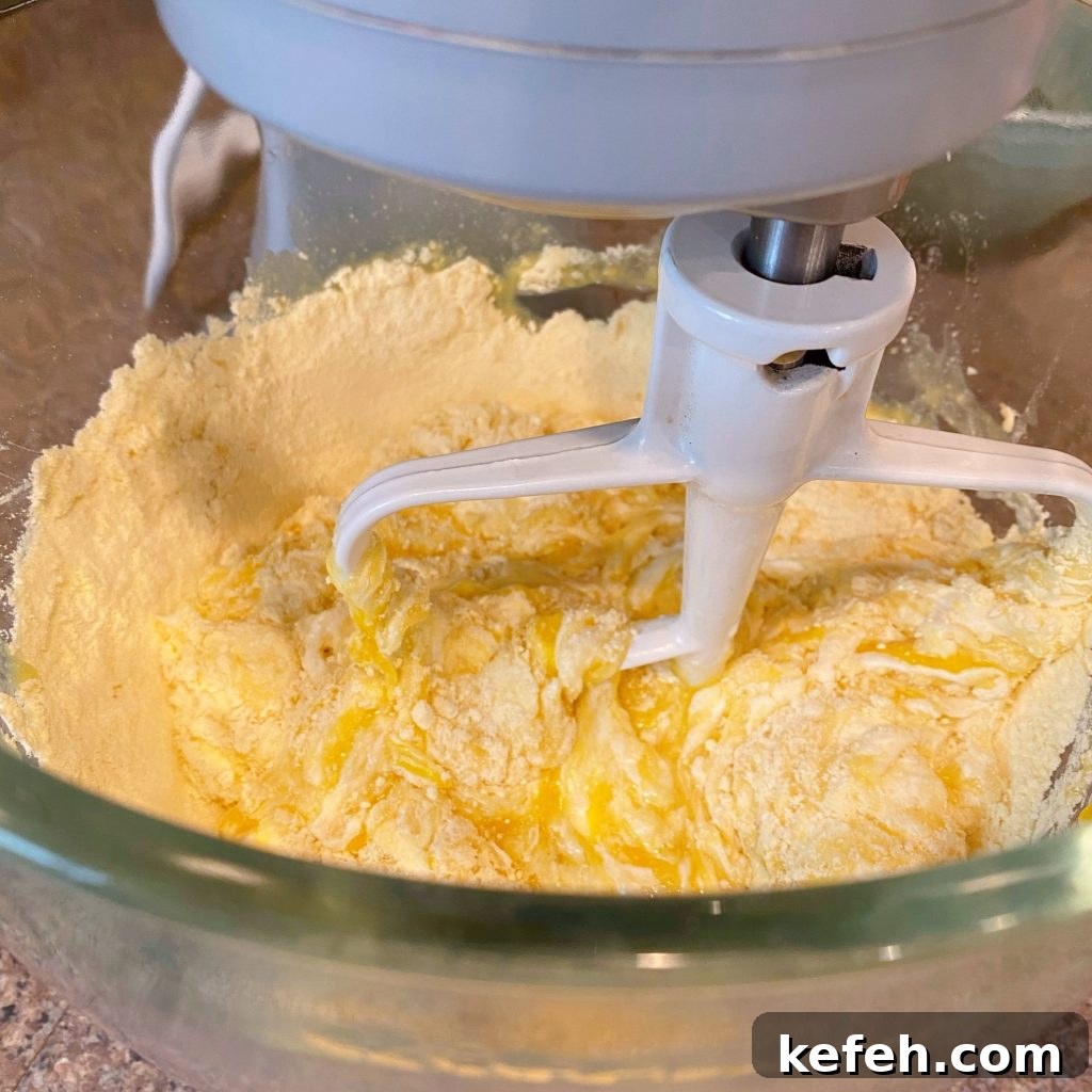 Quick Lemon Streusel Bread from Cake Mix 4 Mixing bowl of stand mixer with bread ingredients being blended.