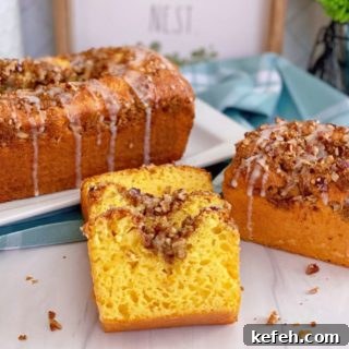 Quick Lemon Streusel Bread from Cake Mix 9 Lemon Streusel Quick Cake Mix Bread sliced and staggered on top of each other with larger loaves in the background.