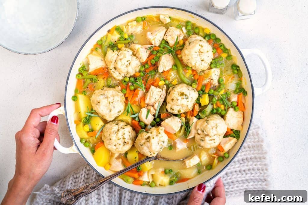 Slimming World Chicken Casserole with dumplings in a cast iron pot