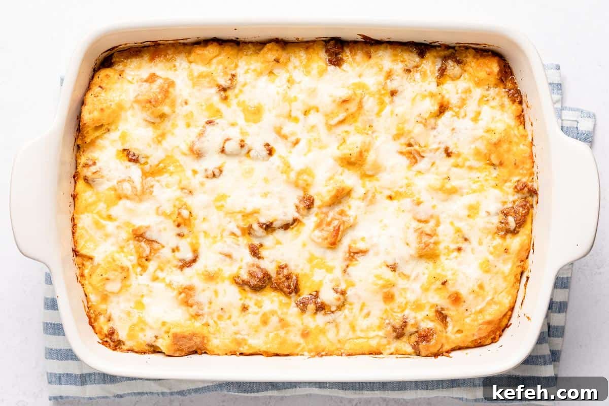 baked breakfast casserole resting on striped cloth
